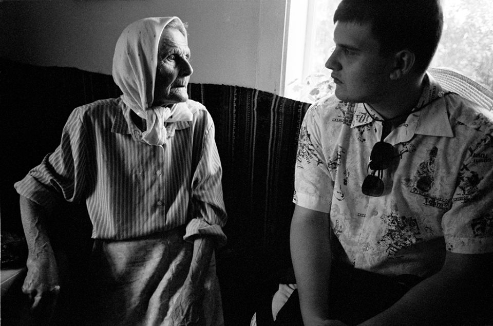 Ilia, a history major, interviews people in Nepolokivtsi, UA about their memories of WWII and the Jewish people who once lived here. 2013 ©Sylvia de Swaan