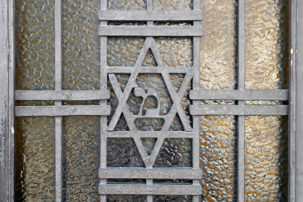 A forgotten blessing at the front door of a former synagogue