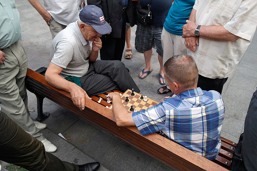 Old men playing chess at Svoboda Boulevard - a free pleasure