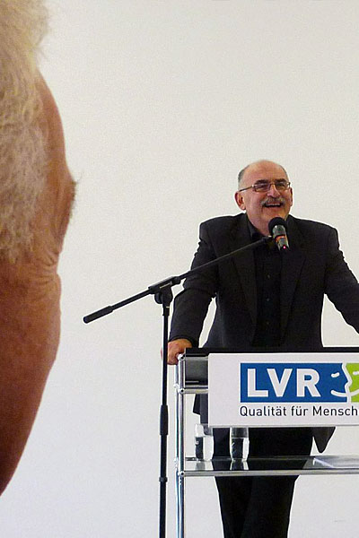 Exhibition opening, Cologne, September 17, 2014. Edgar Hauster speaking. Photo: Marion Tauschwitz