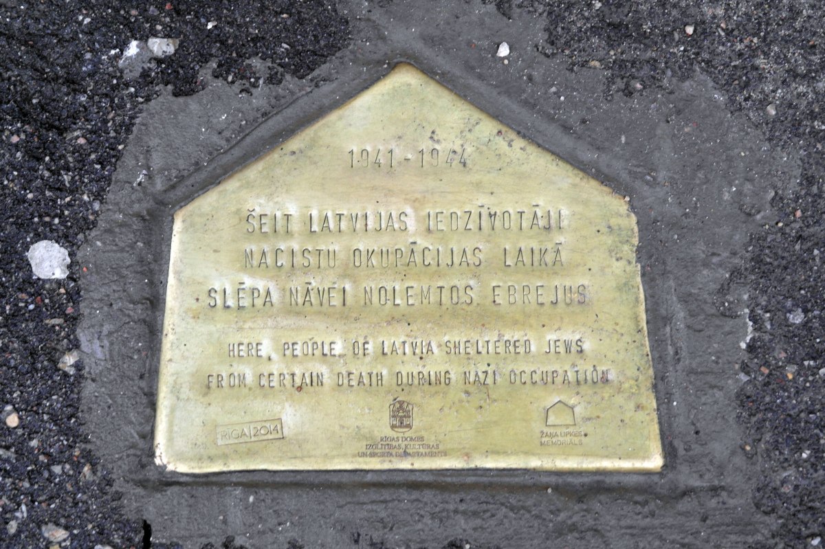 A plaque marks a building where Jews were hidden by Latvians