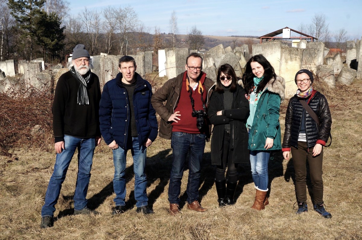 5 persons looking towards the camera