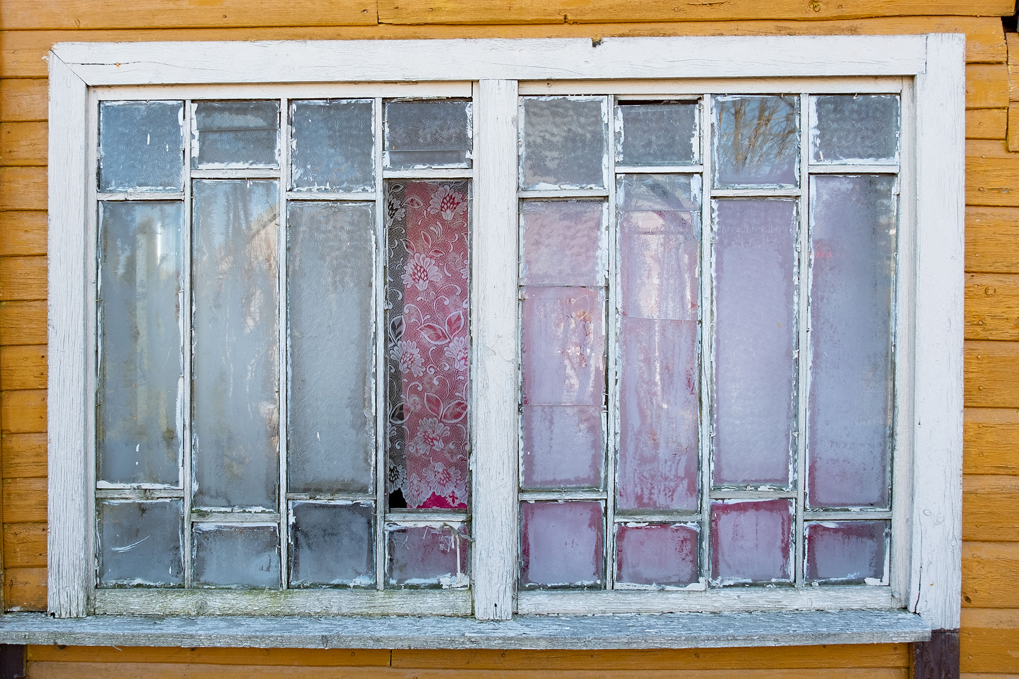 Krekenava, window of an old wooden house